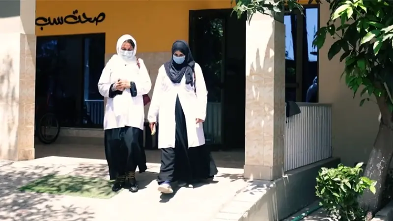 SHINE Humanity healthcare workers walking through a rural Sindh community clinic