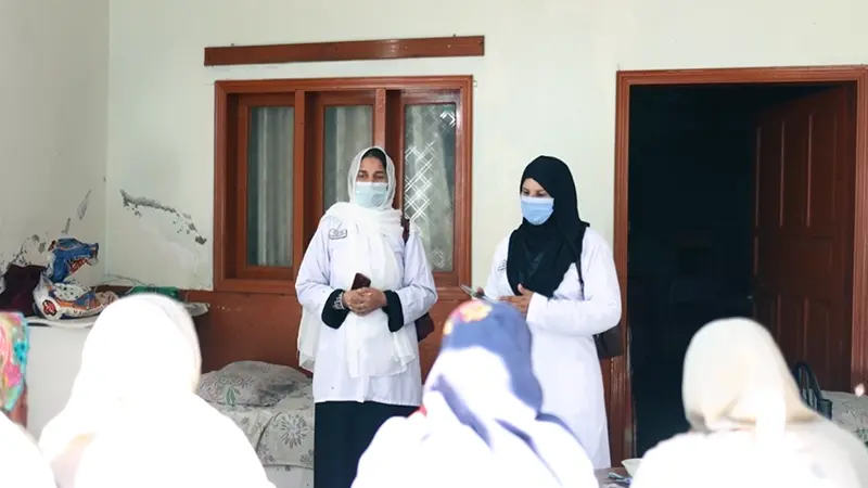 SHINE Humanity healthcare staff providing women's health services at a community outreach visit in rural Sindh