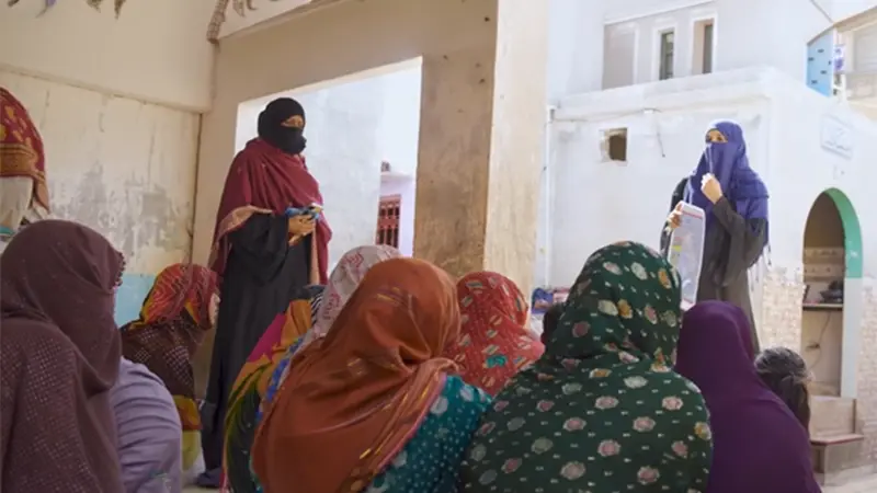 SHINE Humanity health worker supporting a mother with infant feeding guidance