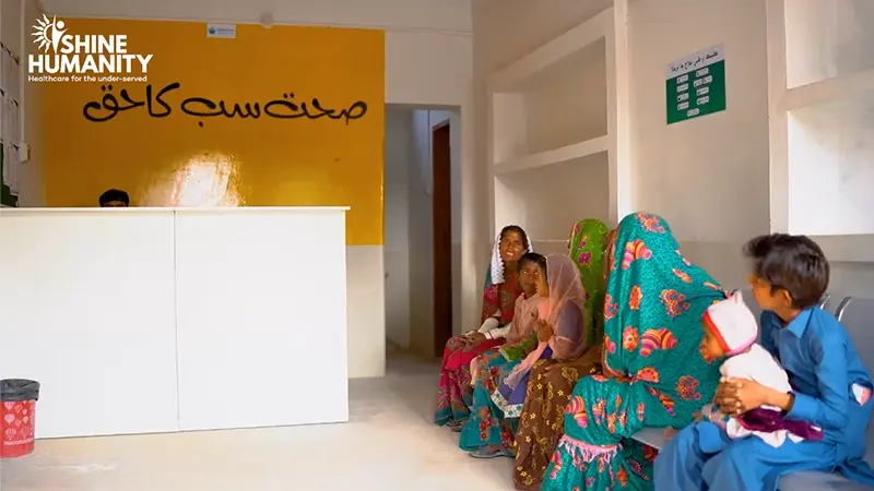 Patients waiting at a SHINE Humanity free healthcare clinic in rural Sindh